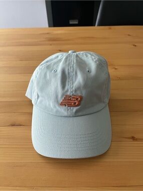 New Balance Light Blue Cap with Bronze Logo